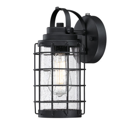 Eshana Black 12"" H Seeded Glass Outdoor Wall Lantern with Dusk to Dawn -  Breakwater Bay, 0944556B9D4041939533445450C7C280