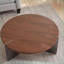 Table basse ronde en bois de noyer avec pieds en métal noir, facile à nettoyer et à assembler rapidement pour le salon