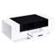 Table basse blanche et noire pour l'espace de vie: tiroir spacieux et tablette moderne: rangement avec 4 tablettes robustes