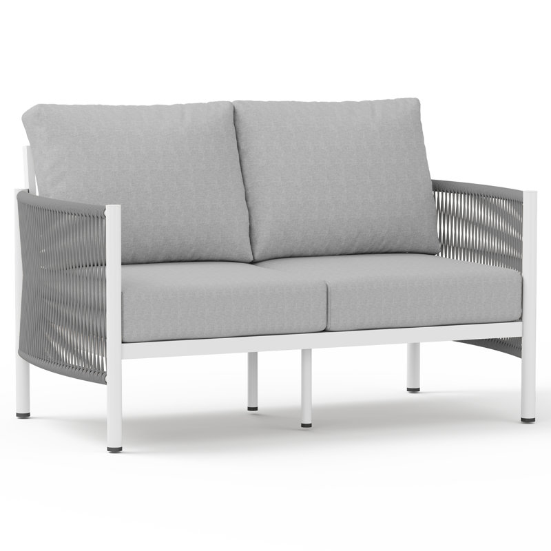 Canapé d'extérieur bohème deux places en aluminium de 130 cm (51 po) avec coussins de 15 cm (6 po) d'épaisseur, structure antirouille et revêtement en PEHD tissé à la main.