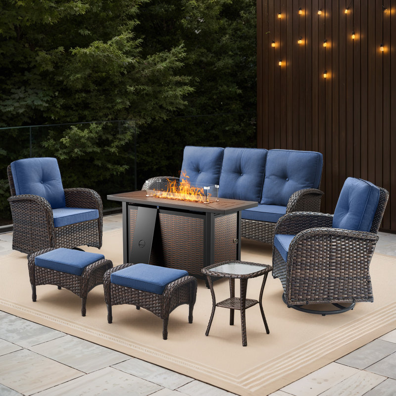 Valierius 7-Piece Outdoor Wicker Set With Fire Pit, 3-Seater Sofa, Swivel Chairs & Ottomans, Blue