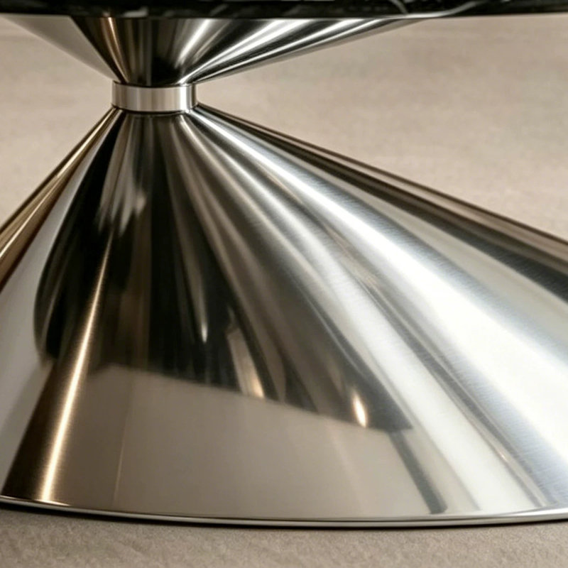 Table basse moderne 51 po ovale en pierre frittée avec base géométrique en acier inoxydable