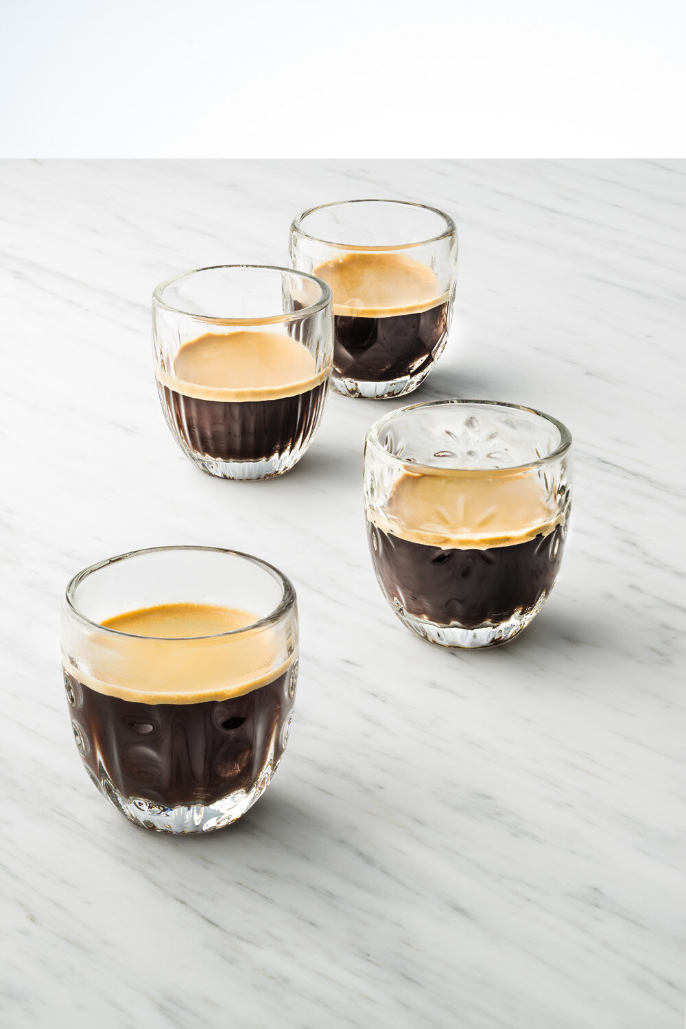 https://assets.wfcdn.com/im/67200786/compr-r85/4048/40483007/la-rochere-espresso-4-piece-32oz-glass-drinking-glass-glassware-set.jpg