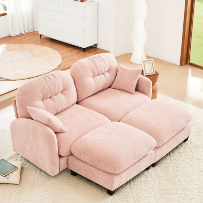 Canapé d'angle de style nuage rose avec coussins moelleux, courbes ergonomiques, idéal pour différents espaces. Chenille, design, salon modulable.