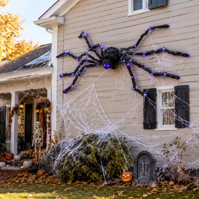 Décoration d'araignée lumineuse pour l'Halloween, araignée géante de 120 cm avec pattes flexibles et lumineuses DEL violettes, idéale pour décorer le jardin, la pelouse et la maison hantée.