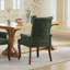 Chaise de salle à manger élégante en tissu chenille, pieds en bois courbés, dossier capitonné et accoudoirs confortables pour intérieurs modernes.-134683117-134683115
