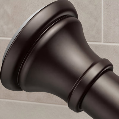 An oil rubbed bronze shower tension rod adjustable from 18-79 inches and designed to fit 20-78 inch spaces, including being ideal for 72" wide bathrooms; the durable spring system offers rust resistance and installs without drilling.