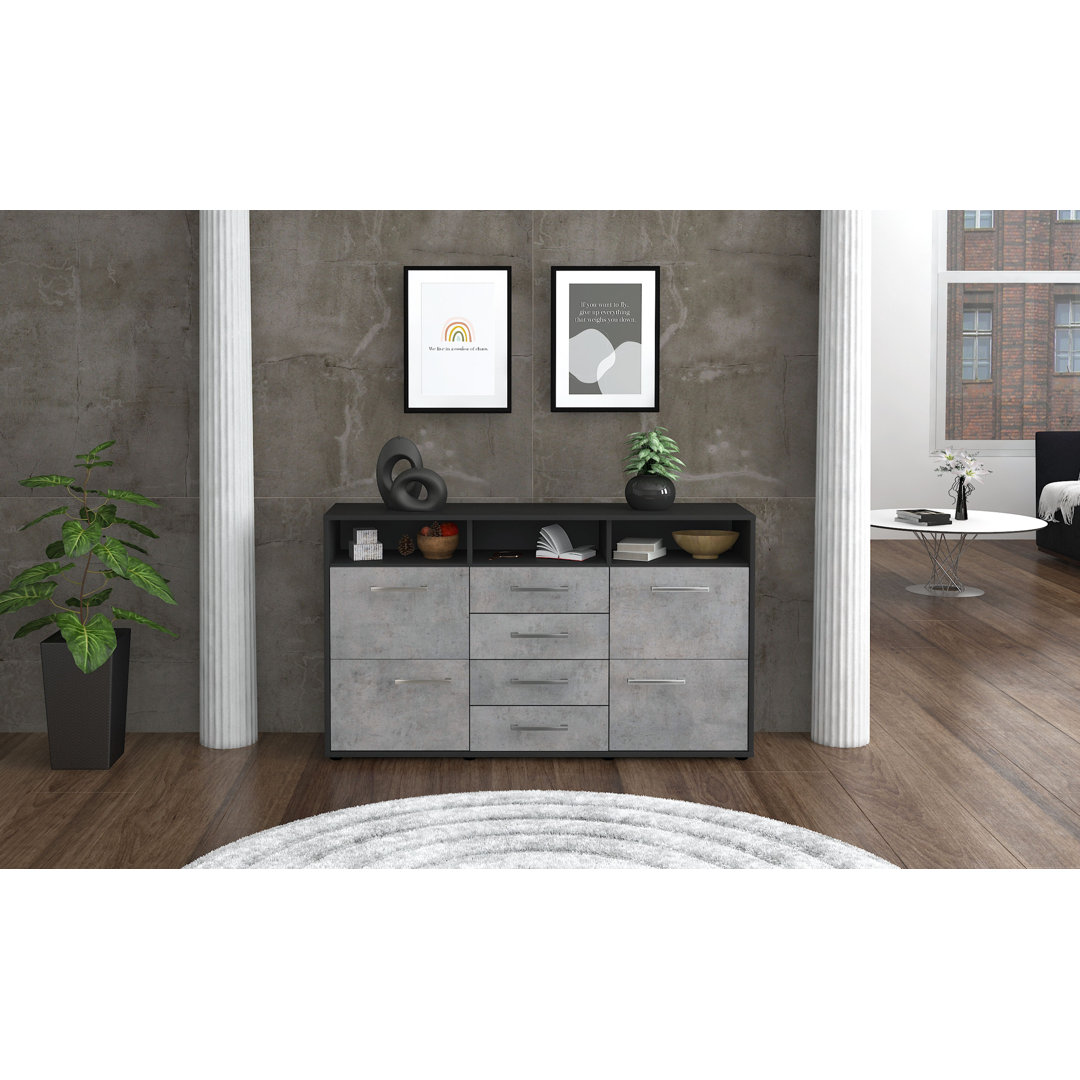 Das Sideboard Donabella hat einen weißen Korpus und eine orange Hochglanzfront. Es misst 136 cm x 79 cm x 35 cm und verf...