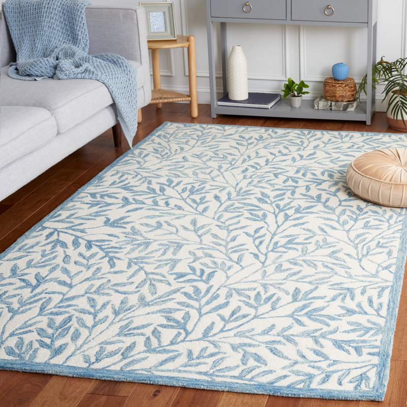 Iqarar Hand Tufted Wool/Cotton Floral Rug in Blue/Ivory, Rectangle 5' x 8'