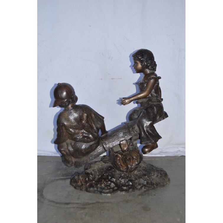 McVicar A Boy and A Girl Playing Seesaw Bronze Statue - Size: 17L x 33W x 36H. Wildon Home