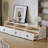 Cream style coffee table paired with TV stand
