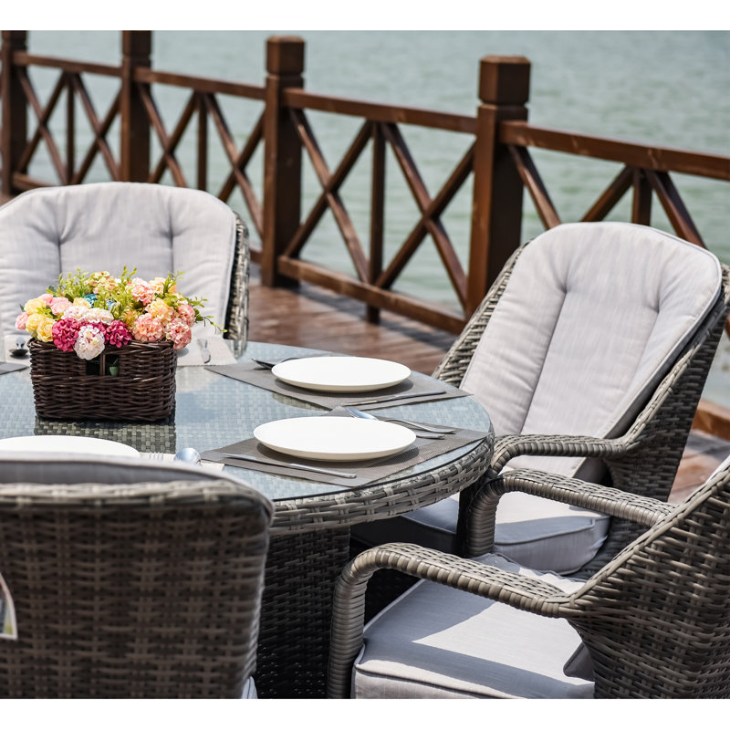 Algird 6 - Person Wicker Patio Dining Set with Round Table , Cushions Included, Grey, Grey