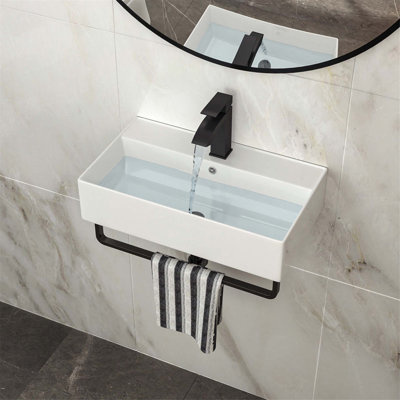 Wall-Mounted Ceramic Bathroom Sink with Integrated Black Towel Bar/ Overflow Drain/ and Faucet for Modern Spaces.
