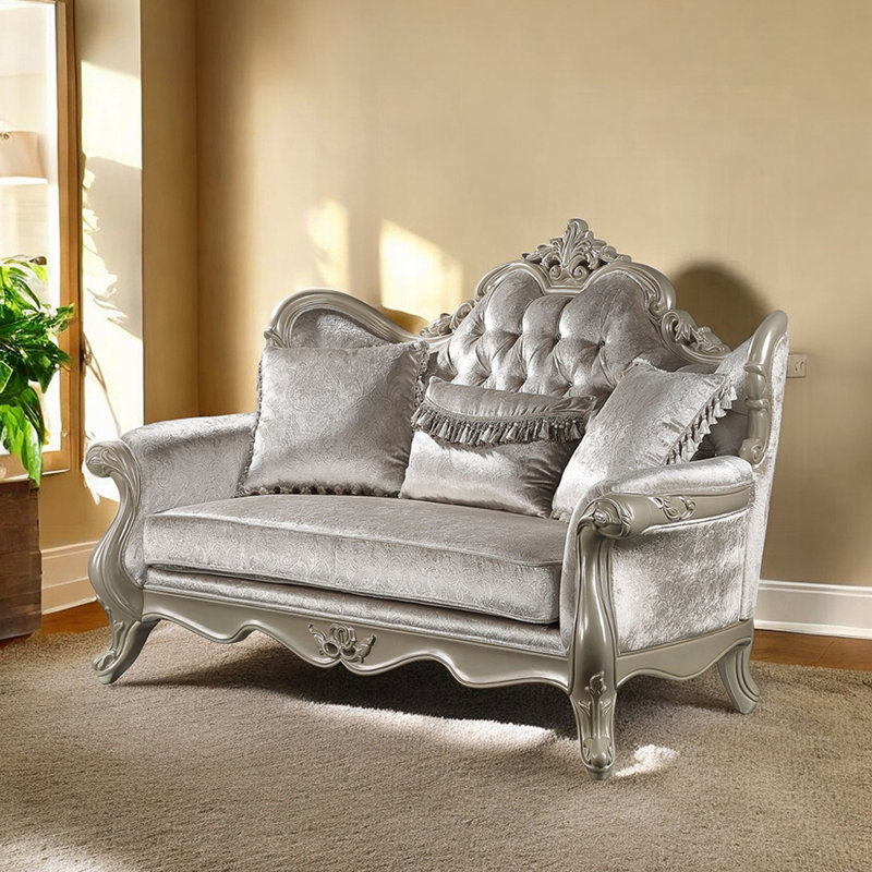 Canapé deux places de 179 cm de large avec 3 coussins, tissu beige et champagne
