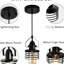 Luminaire industriel réglable à cage métallique - ampoule E26 noire matte à intensité variable créant une atmosphère confortable et élégante dans la salle à manger du salon