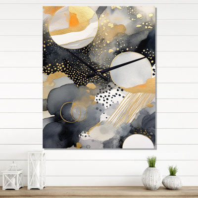 Horloge murale pastel abstraite avec taches noires et dorées