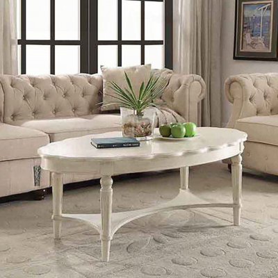 Table basse antique blanche avec tablette ouverte et pieds tournés