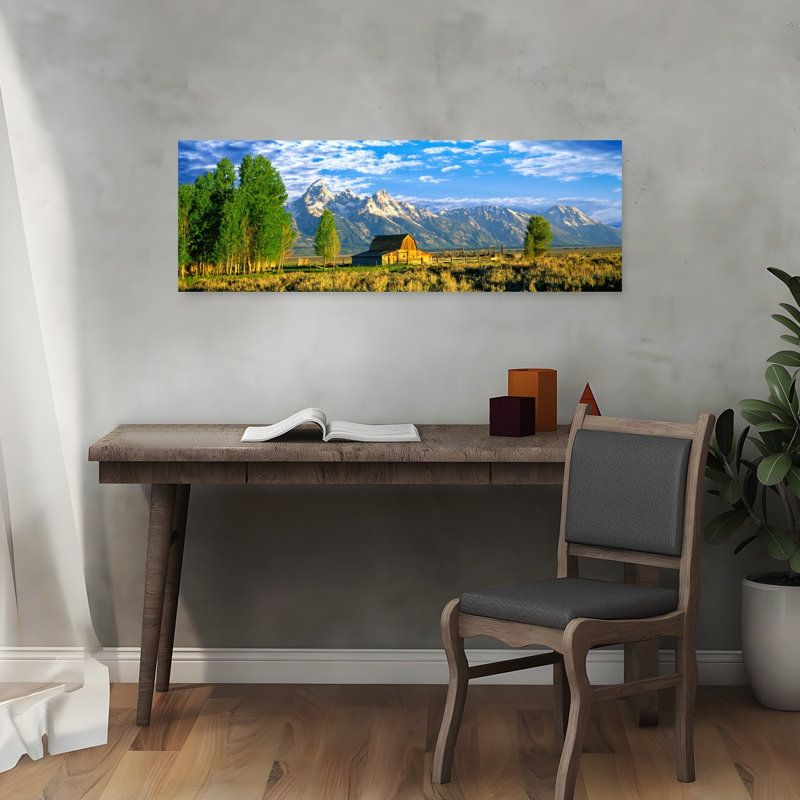 Sunrise Over The Moulton Barn Along Mormon Row Teton Range Mormon Row Historic District Grand Teton National Park Wyoming USA by Leo L. Larson - Wrapped Canvas Panoramic Print