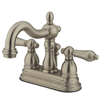 Kingston Brass Heritage Two-Handle 3-Hole Deck Mount 4" Centerset Bathroom Faucet with Brass Pop-Up