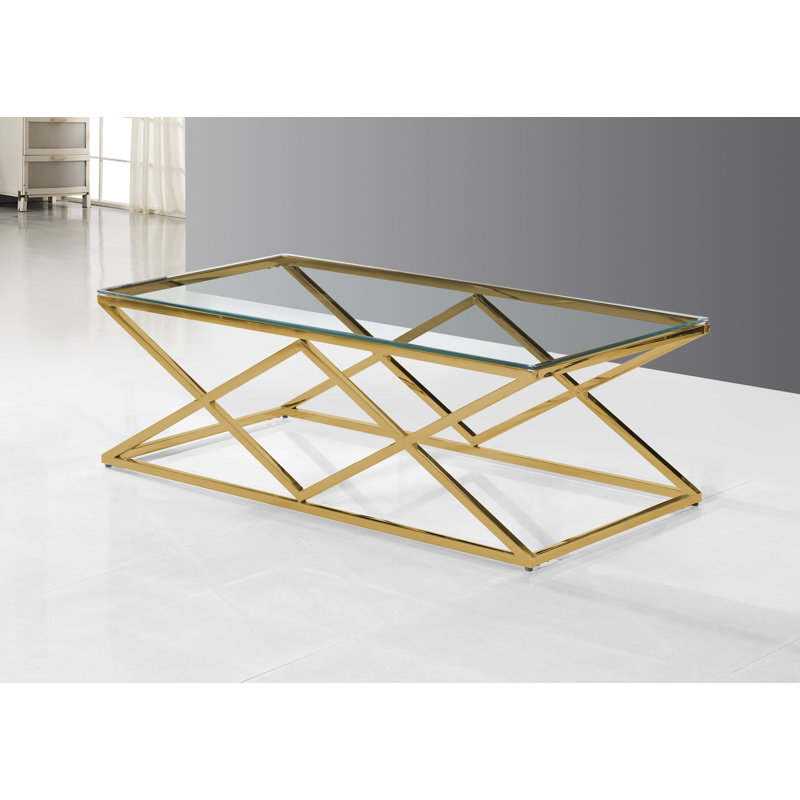 Table basse avec plateau en verre et base en acier inoxydable poli doré