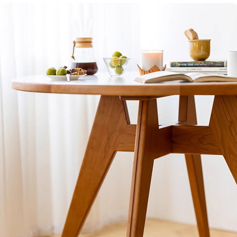 Table de salle à manger en cerisier et dalle de pierre.