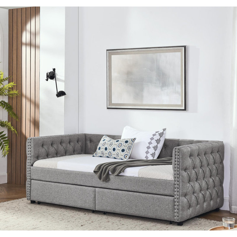 Twin sized upholstered daybed featuring two drawers, adorned with buttons and copper nails on its square arms, Grey