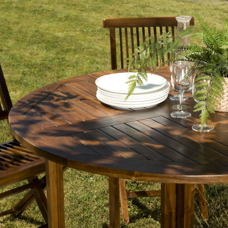 Minnelli 4 - Person Teak Wood Patio Dining Set with Round Table