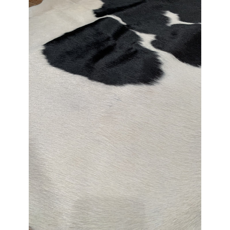 Tapis noir/blanc fait main vache Arachne