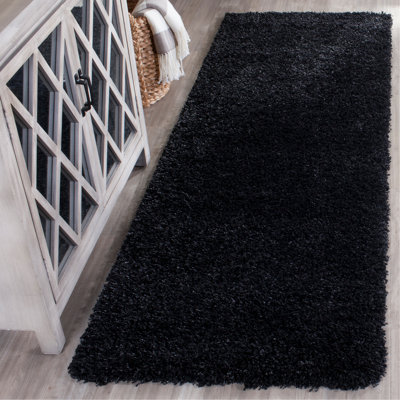 Tapis noir tissé à plat à la main Angeliya