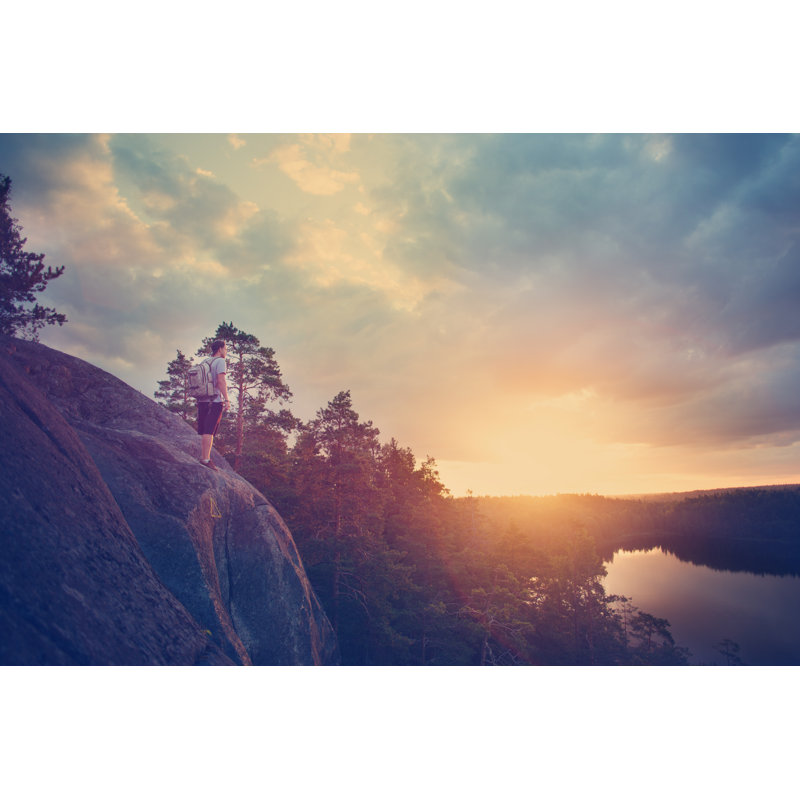 Lonely Traveler With Backpack Looking At Sunset by Littlehenrabi - Wrapped Canvas Print, 30cm H x 46cm W