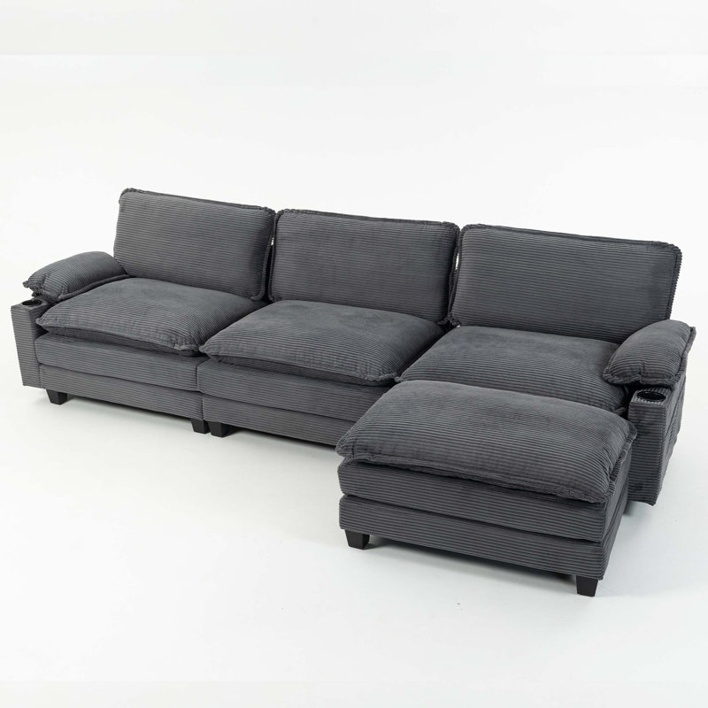 113" Modern 3+1 L-Shaped Corduroy Fabric Sofa,Modular Sectional Cloud Couch W/Ottoman,35D High-resilience Sponge&Double-layer Thick Cushion,Cup Holders,Storage Bags