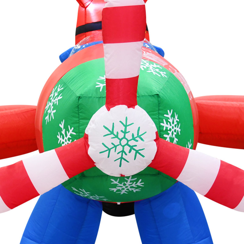 Père Noël vole un avion gonflable