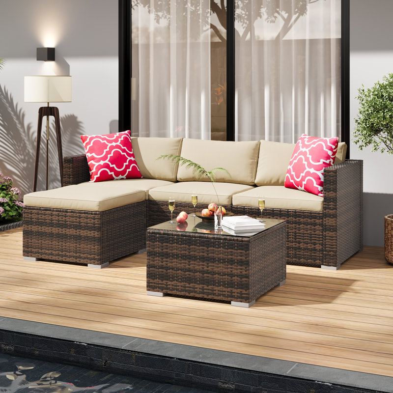 Versatile 5-Piece Outdoor Patio Furniture Set – All-Weather Brown Four-Line Rattan Sectional Sofa with Khaki Cushions, Red Pillows, Glass Coffee Table & Ottoman – For Garden, Backyard, Poolside – Brown four-line rattan + khaki cushion + red pillow