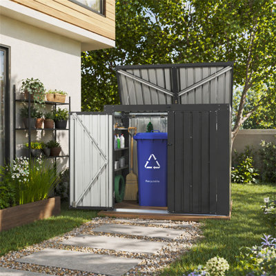 La remise à poubelle permet de ranger 2 poubelles en métal pour le rangement des ordures