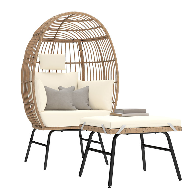Fauteuil ovale rembourré en osier avec repose-pieds