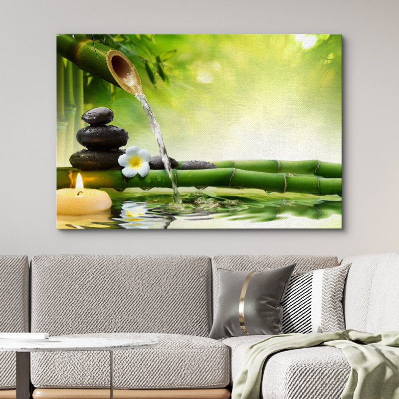 «Zen Stones Rocks and A Flower Over Bamboo on a Lake with a Waterfall», reproduction de photo sur toile tendue