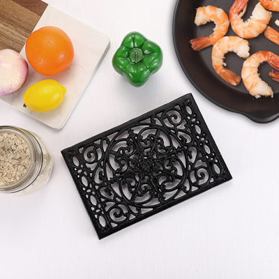 Dessous de plat en fonte, résistants à la chaleur, pour casseroles et poêles chaudes, avec pieds en caoutchouc, pour théière, plat chaud, support pour assiettes et casseroles, idéal pour la table et la plaque de cuisson, lot de 2, noir.