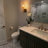 Dimmable Armed Sconce with Prismatic Glass Shade