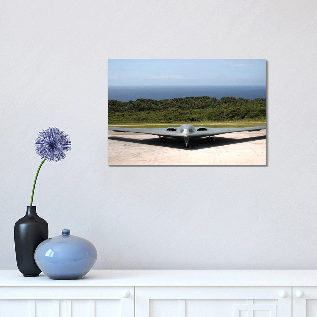 A B-2 Spirit Stealth Bomber Waits On The Flightline - Wrapped Canvas Print
