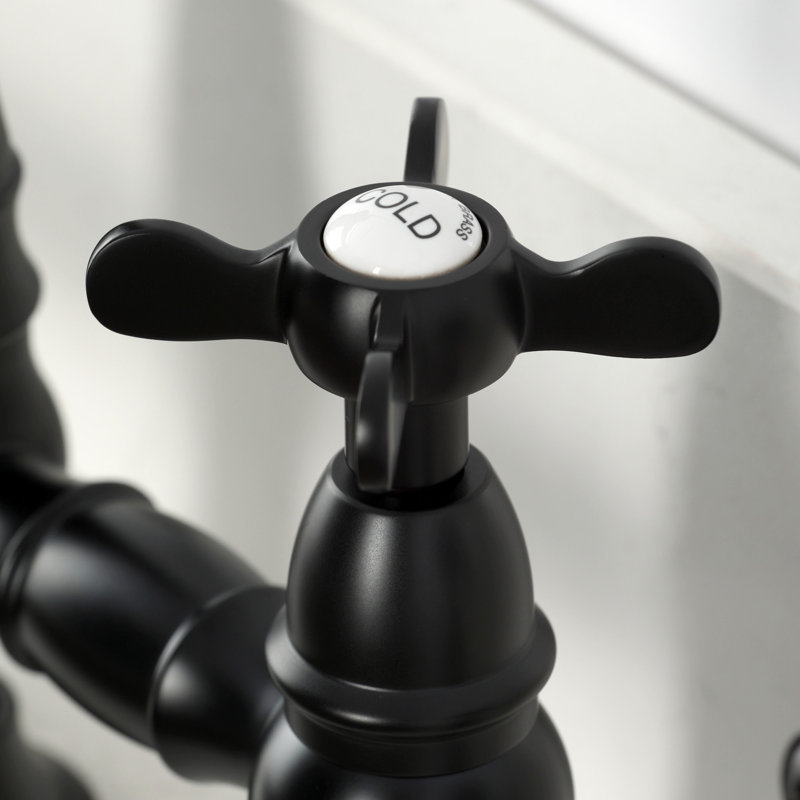 Kingston Brass Essex Two-Handle 4-Hole Deck Mount Bridge Kitchen Faucet With Brass Side Sprayer, Matte Black