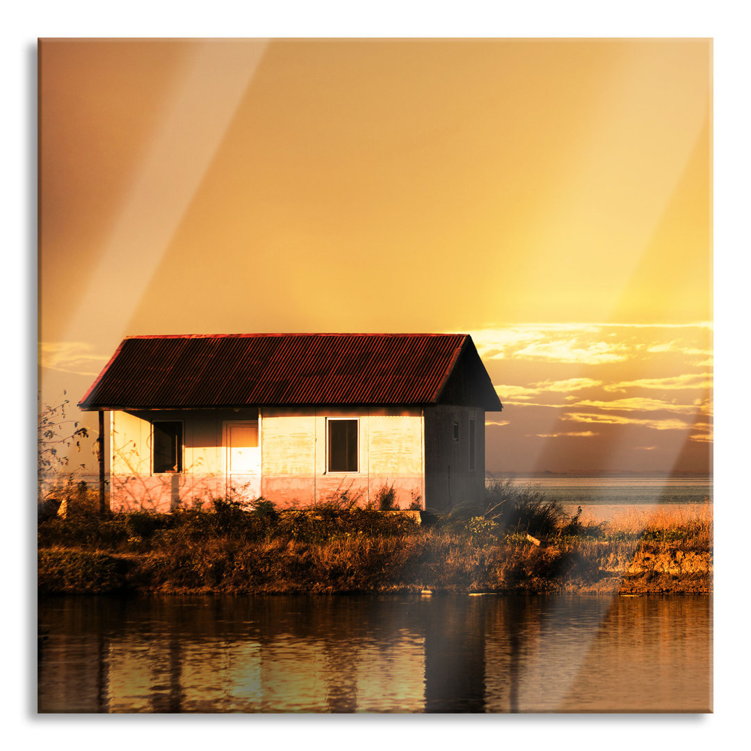 Glasbild Haus am See bei Sonnenuntergang