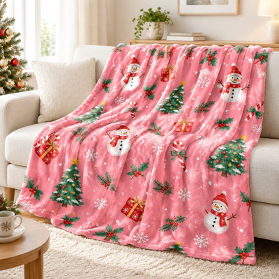Couverture polaire festive à motif sapin et bonhomme de neige, douce et chaude, idéale pour canapé, chambre, salon et décoration intérieure.