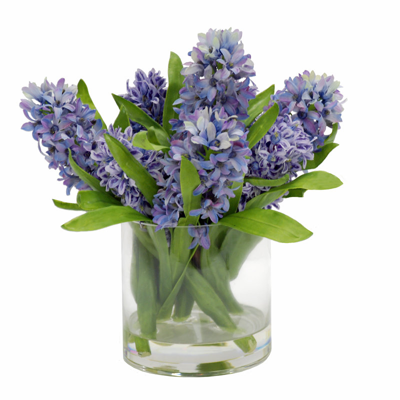Fausse jacinthe mauve dans un vase rond
