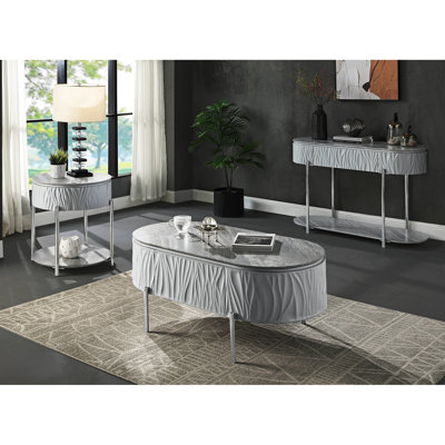 Table basse polyvalente grise avec pattes en métal lustrées et pieds élégants