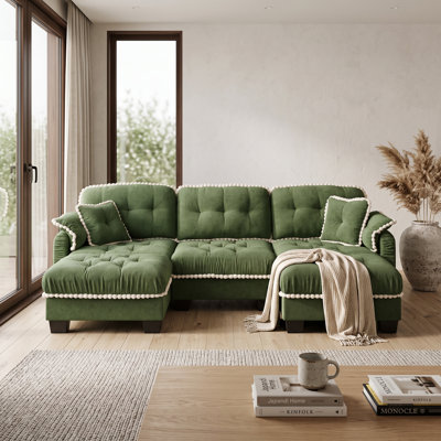 Canapé 3 places vert en chenille motif nuage, avec 2 poufs amovibles, coussins capitonnés et finis à pompons.