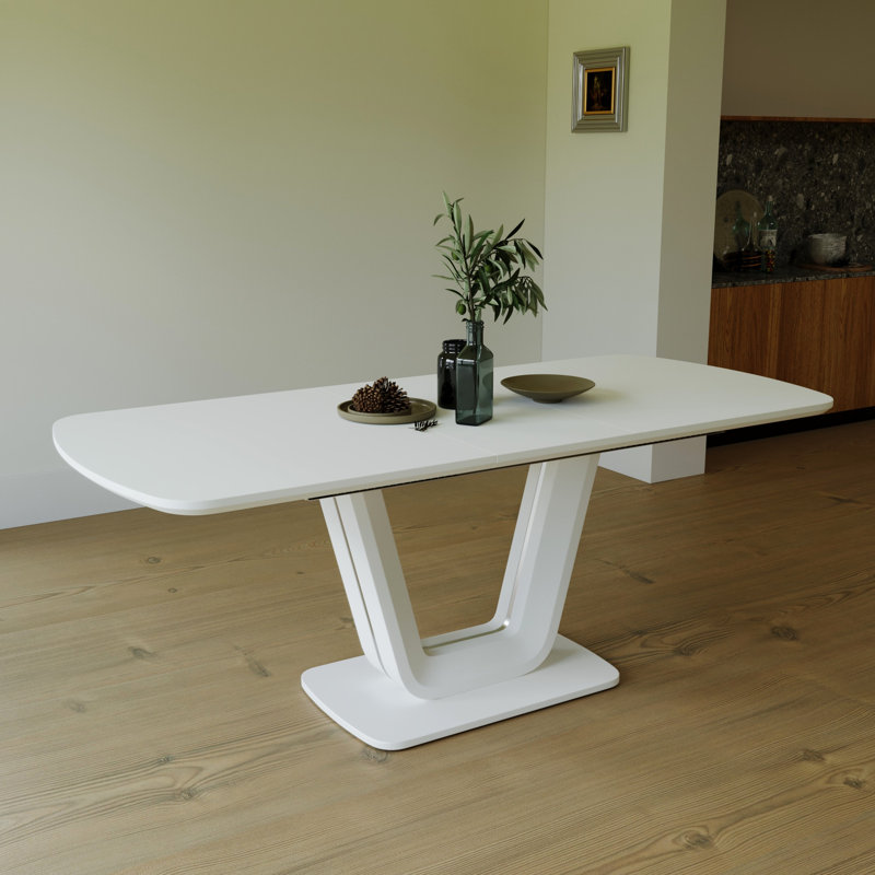 Table extensible blanche avec pieds en forme de U pour une salle à manger moderne et moderne