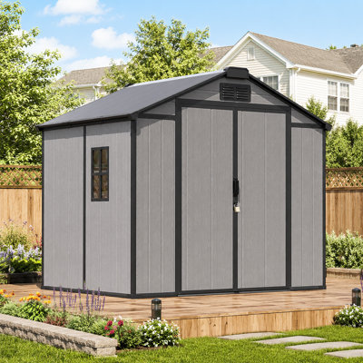 Abri de jardin en résine 2,4 x 1,8 m avec plancher et double porte, gris, avec fenêtre.