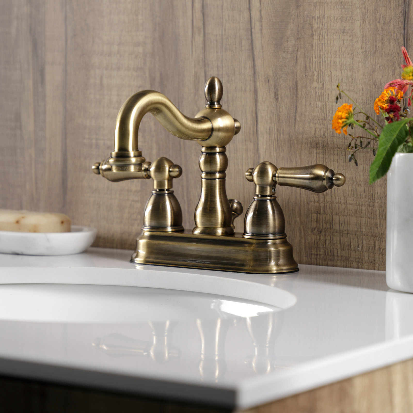 Kingston Brass Heritage Two-Handle 3-Hole Deck Mount 4" Centerset Bathroom Faucet with Plastic Pop-Up, Vintage Brass