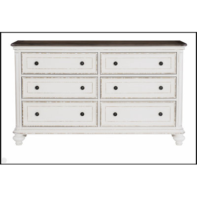 Commode à 6 tiroirs avec poignées noires au fini blanc antique et brun-gris, design traditionnel pour un rangement élégant dans la chambre à coucher