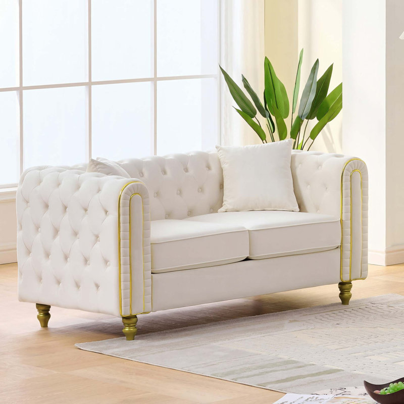 Causeuse Chesterfield en velours moelleux